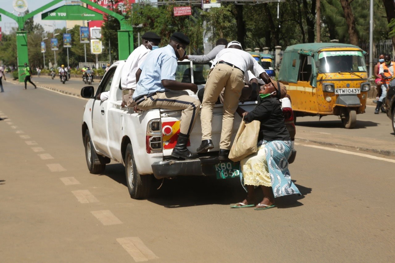 Drama in Kisumu as hawker Beatrice Atieno 39 is dragged at the back of a moving county pickup