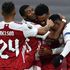 Arsenal's English midfielder Joe Willock (second right) celebrates with teammates after scoring his team's second goal