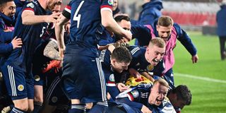 Scotland's players celebrate after winning their Euro 2020 play-off 