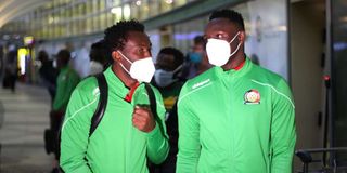 Harambee Stars defender David "Calabar" Owino and captain Victor Wanyama at Jomo Kenyatta International Airport. 