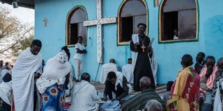 Ethiopian refugees pray