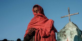 Ethiopian refugee in Sudan prays