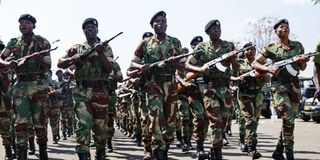Zimbabwean army officers run in formation
