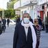Tunisians clad in masks 