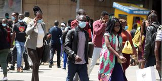 City resident walk along Tom Mboya Street, Nairobi