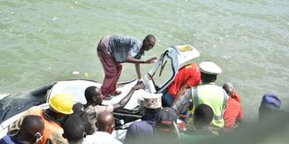 Rescuers retrieve a car from the ocean in Mombasa