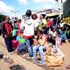 People wait to travel to western Kenya from Machakos Country Bus Station in Nairobi on December 20, 2020.