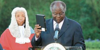 President Mwai Kibaki swearing in Evans Gicheru