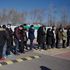 People wait to board shuttle buses to a Covid-19 vaccine center in Beijing on January 5, 2021.