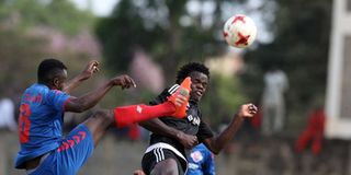 Kibera Black Stars' Austin Moya (right) vies for the ball with FC Talanta's Jacton Opanda NSL 
