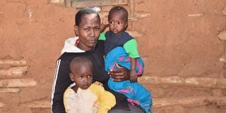 Hellen Naasu, John Gakuya’s widow, with her children at their home in Maralal.