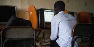 A man uses a computer at in Kampala, Uganda in January 2021. 