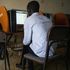 A man uses a computer at in Kampala, Uganda in January 2021. 