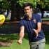 Novak Djokovic plays with a rugby ball