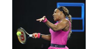 Serena Williams of the US hits a return against Danielle Collins of the US