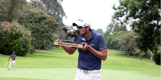 Mohit Mediratta kisses the title after winning the eighth leg of the Safari Tour 