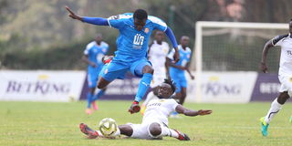Nairobi City Stars midfielder Sven Yidah evades a tackle from Tusker midfielder Apollo Otieno 
