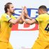 Tottenham Hotspur striker Harry Kane (left) celebrates scoring his team's first goal with teammate Carlos Vinicius Alves Morais