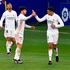 Real Madrid defender Raphael Varane (right) celebrates with teammates 