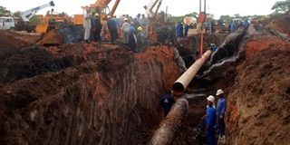 Workers from the Sudanese oil pipeline in the disputed Abyei area reconstruct the line on June 14, 2013.