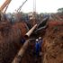 Workers from the Sudanese oil pipeline in the disputed Abyei area reconstruct the line on June 14, 2013.
