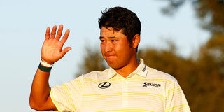 Hideki Matsuyama of Japan celebrates during the Green Jacket Ceremony after winning the Masters at Augusta National Golf Club 