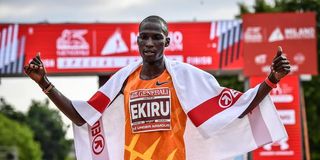 Titus Ekiru celebrates after winning the Milano Marathon men's race in Italy on May 16, 2021