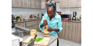 World half marathon record holder Peres Jepchirchir prepares a meal at her home