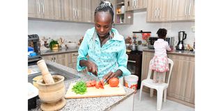 World half marathon record holder Peres Jepchirchir prepares a meal at her home 