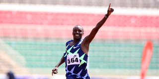 Michael Kibet of Kenya Police celebrates winning the men's 5,000 metres race