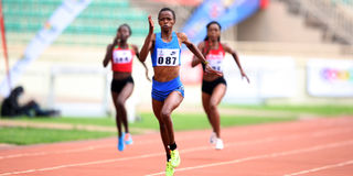 Hellen Syombua (centre) sprints to the finishing line of women's 400 metres race 