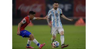 Chile's Pablo Galdames (left) and Argentina's Lionel Messi vie for the ball during their World Cup qualifier