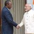 Kenya's President Uhuru Kenyatta (left) shakes hands with India's Prime Minister Narendra Modi