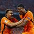 Denzel Dumfries of Holland is congratulated by teammate Donyell Malen