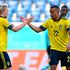 Sweden's midfielder Emil Forsberg (left) celebrates with teammate Robin Quaison after scoring a goal 