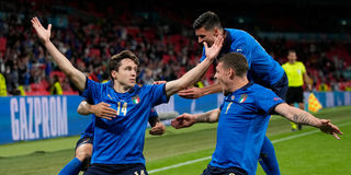 Italy's midfielder Federico Chiesa (left) celebrates with teammates