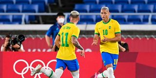 Brazil's forward Richarlison (right) celebrates with teammate Antony 