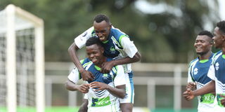 KCB defender Baraka Badi celebrates with teammates 