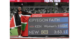Kenya's Faith Kipyegon poses after winning the women's 1500m final 
