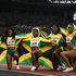 Team Jamaica celebrate gold after the women's 4x100m relay final 