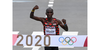 Kenya's Eliud Kipchoge celebrates winning men's marathon