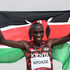 Kenya's Eliud Kipchoge celebrates after winning the men's marathon final 