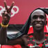 Kenya's Eliud Kipchoge celebrates after winning the men's marathon