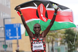 Kenya's Eliud Kipchoge celebrates after winning the men's marathon final