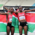 Teresia Muthoni and Zenah Jemutai celebrate with flag