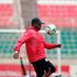 Kenya's Harambee Stars head coach Jacob "Ghost" Mulee juggles a ball