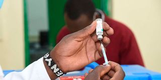 A nurse prepares to administer Covid-19 vaccine
