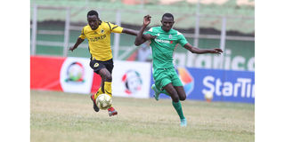 Tusker FC midfielder Rodgers Ouma (left) vies for the ball with Gor Mahia forward Samuel Onyango