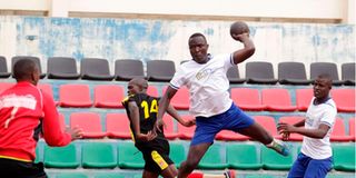 George Mwangi of Tigers shoots to score past Gunners goalkeeper Mohammed Jafar 
