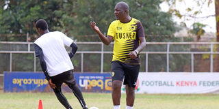 Tusker coach Robert Matano (right) gestures during a training session at Ruaraka grounds on October 12, 2021.
